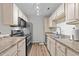 Well-lit kitchen with stainless steel appliances, stylish countertops, and ample cabinet space at 3795 Hitchcock Way # 618, Myrtle Beach, SC 29577