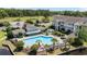 An overhead image of a pool featuring plenty of chairs, palm trees, and green landscaping at 3795 Hitchcock Way # 618, Myrtle Beach, SC 29577