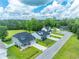 Neighborhood street view with well-maintained lawns and attractive single-Gathering homes at 395 Dunbarton Ln., Conway, SC 29526