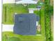 Aerial view of a well-maintained home with a dark shingled roof, landscaped yard, and patio with a fire pit at 395 Dunbarton Ln., Conway, SC 29526