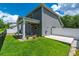 Backyard featuring green lawn, a covered patio, and a white privacy fence at 395 Dunbarton Ln., Conway, SC 29526