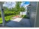 Backyard concrete patio with string lights, privacy fence, and side yard at 395 Dunbarton Ln., Conway, SC 29526