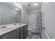 Bathroom featuring double sink vanity, tile floors, shower/tub combo, and framed mirror at 395 Dunbarton Ln., Conway, SC 29526
