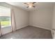 Bedroom with carpeted floor, ceiling fan, and window providing view to the outdoors at 395 Dunbarton Ln., Conway, SC 29526