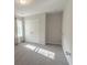 Bright bedroom with double closet, neutral paint, carpeted floor, and natural light from large window at 395 Dunbarton Ln., Conway, SC 29526
