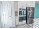 Modern kitchen featuring stainless steel appliances, gray backsplash, and white cabinetry at 395 Dunbarton Ln., Conway, SC 29526