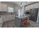 Well-equipped kitchen boasts stainless steel appliances, a center island with bar seating, and ample cabinet space at 395 Dunbarton Ln., Conway, SC 29526