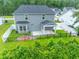 Backyard featuring a patio area, covered porch, fenced yard, and lush green landscaping at 395 Dunbarton Ln., Conway, SC 29526