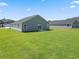 Spacious backyard featuring lush green grass and the home's rear exterior at 40 Cape Point Dr., Conway, SC 29527