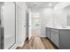 A bright bathroom features gray cabinetry, a shower and walk-in closet at 40 Cape Point Dr., Conway, SC 29527