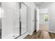 A bright bathroom features a shower and a doorway to the bedroom at 40 Cape Point Dr., Conway, SC 29527