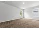 A bright bedroom with neutral walls, plush carpet and two windows at 40 Cape Point Dr., Conway, SC 29527