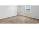 Cozy bedroom with plush carpeting, ample natural light from the window, and neutral decor at 40 Cape Point Dr., Conway, SC 29527