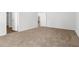Neutral bedroom showcasing plush carpeting, and an open door leading to additional rooms at 40 Cape Point Dr., Conway, SC 29527