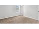 Bright bedroom features neutral carpet, white walls, window view and an open door at 40 Cape Point Dr., Conway, SC 29527