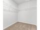 A bright walk-in closet features carpeted floors and wire shelving at 40 Cape Point Dr., Conway, SC 29527