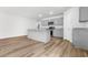 Charming kitchen boasts granite countertops, gray cabinets, stainless appliances, and wood floor at 40 Cape Point Dr., Conway, SC 29527