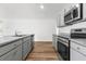 Stylish kitchen with stainless appliances, granite counters and an island overlooking the living space at 40 Cape Point Dr., Conway, SC 29527