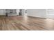 Open floor plan features wood floors, large windows, and views of the kitchen and eating area at 40 Cape Point Dr., Conway, SC 29527