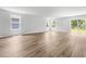 Spacious living room with wood floors, natural light, and access to the backyard through glass doors at 40 Cape Point Dr., Conway, SC 29527