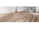 Open-concept living area with stylish flooring, connecting seamlessly to the kitchen and dining spaces at 40 Cape Point Dr., Conway, SC 29527