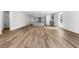 Open-concept living area featuring modern kitchen with gray cabinets and new laminate flooring at 40 Cape Point Dr., Conway, SC 29527