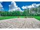 Paver patio overlooks expansive lawn and distant tree line at 4260 Long Avenue Ext., Conway, SC 29526
