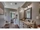 Bathroom with granite countertops, large vanity, and decorative mirror at 4260 Long Avenue Ext., Conway, SC 29526
