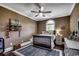 Cozy bedroom with ceiling fan, arched window, and dark wood floors at 4260 Long Avenue Ext., Conway, SC 29526