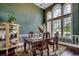Elegant dining room with decorative trim, hardwood floors, a chandelier, and large windows at 4260 Long Avenue Ext., Conway, SC 29526