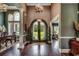 Grand foyer with soaring ceilings, hardwood floors, arched doorway and large arched double-door entry at 4260 Long Avenue Ext., Conway, SC 29526