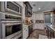 Gourmet kitchen showcasing stainless steel appliances, granite countertops, and custom cabinetry at 4260 Long Avenue Ext., Conway, SC 29526