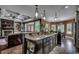 Open-concept kitchen with granite countertops and a view of the adjacent living area at 4260 Long Avenue Ext., Conway, SC 29526