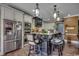 Elegant kitchen featuring a dark island with seating and stainless steel appliances at 4260 Long Avenue Ext., Conway, SC 29526