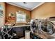 Laundry room features front loading washer and dryer and storage cabinets at 4260 Long Avenue Ext., Conway, SC 29526