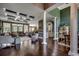 Spacious living area with hardwood floors, columns, high ceilings, and an open floor plan at 4260 Long Avenue Ext., Conway, SC 29526