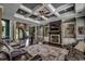 Living room boasting fireplace, custom built-ins, coffered ceilings, and hardwood floors at 4260 Long Avenue Ext., Conway, SC 29526