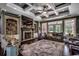 Cozy living room with fireplace, hardwood floors, custom built-ins, and a coffered ceiling at 4260 Long Avenue Ext., Conway, SC 29526