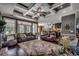 Open living room with coffered ceiling, hardwood floors and view to the kitchen at 4260 Long Avenue Ext., Conway, SC 29526