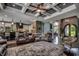Spacious living room with coffered ceiling, open floor plan and hardwood floors at 4260 Long Avenue Ext., Conway, SC 29526