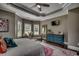 Serene main bedroom features hardwood floors, tray ceiling, and ample natural light at 4260 Long Avenue Ext., Conway, SC 29526