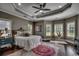 Stylish main bedroom with tray ceiling, hardwood floors, and natural light at 4260 Long Avenue Ext., Conway, SC 29526