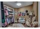 Spacious walk-in closet with custom shelving, seating area, and decorative mirror at 4260 Long Avenue Ext., Conway, SC 29526