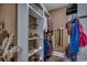 Custom walk-in closet with shoe racks, clothing rods, and ample storage space at 4260 Long Avenue Ext., Conway, SC 29526
