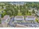 Aerial view of the tops of the condo buildings and parking lots that are nicely landscaped at 4787 Wild Iris Dr. # 303, Myrtle Beach, SC 29577