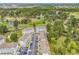 View of condo buildings surrounded by large shade trees, golf course and ponds at 4787 Wild Iris Dr. # 303, Myrtle Beach, SC 29577