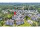 Aerial photo of the condo buildings, parking lot and community pool and surrounding landscape at 4787 Wild Iris Dr. # 303, Myrtle Beach, SC 29577