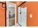 Bathroom featuring a glass-enclosed shower and view into the hall and living area beyond at 4787 Wild Iris Dr. # 303, Myrtle Beach, SC 29577