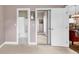 Hallway offering access to a bathroom, closet, and living area, providing convenient flow throughout the space at 4787 Wild Iris Dr. # 303, Myrtle Beach, SC 29577
