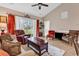 Cozy living room with vaulted ceiling, sliding glass doors to the outside, and comfortable seating at 4787 Wild Iris Dr. # 303, Myrtle Beach, SC 29577